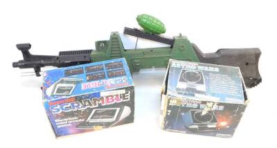 A Grandstand Scramble Electronic Mini Arcade Game, Grandstand Astro Wars Game, both boxed, together with a Topper Toy Tommy Gun, Johnny 7 OMA. (3)