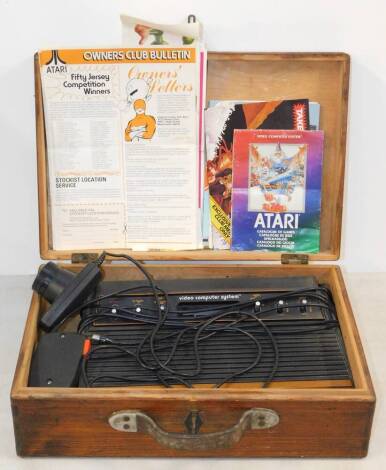 An Atari Video Computer System, together with leaflets and bulletins.