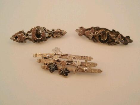 Three silver Victorian panel brooches