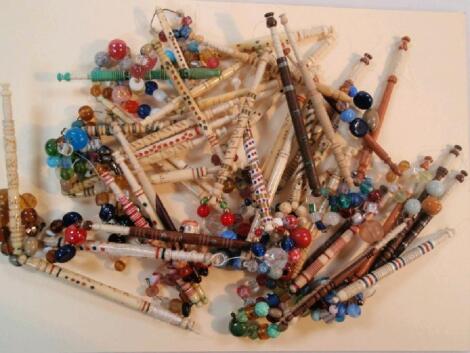 A collection of bone, ivory and wood lace bobbins