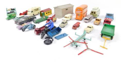 Corgi Lesney and Dinky Matchbox die cast vehicles, including a Dinky Toys Bristol 173 twin blade heli-plane, Meccano double rack of tyres, Corgi Smith's Karrier Shop, Matchbox garage, and a Corgi Ford Thames Airborne Caravan. (qty)