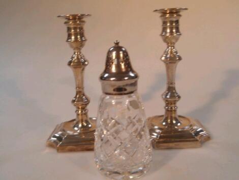 A pair of silver candlesticks