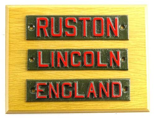 An oak mounted cast iron sign, in three parts for Ruston Lincoln England, 17cm x 23cm.