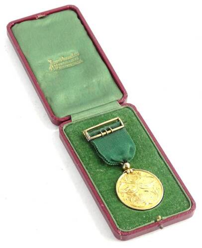 A Ruston and Hornsby Limited silver gilt 50 years faithful service medal, awarded to an Albert Wall (1893-1943), in original box.