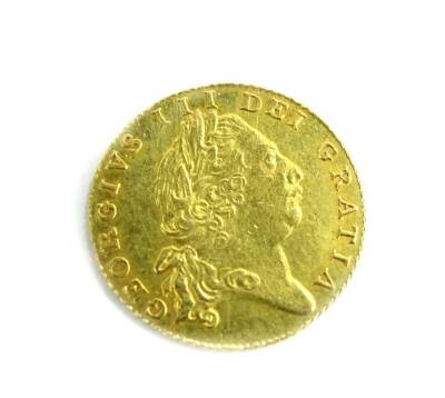 A George III 1801 gold half guinea, 4.2g. - 2