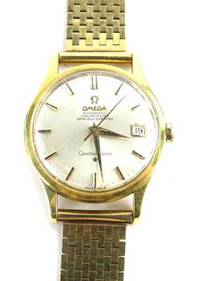 An Omega automatic chronometer Constellation gentleman's wristwatch, with 9ct gold strap, 68.6g all in.