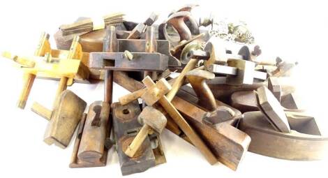 Various early 20thC tools, wooden block planes, plough plane, 12cm H, various other named tools, large angle planes, two piano sconces, etc. (a quantity)