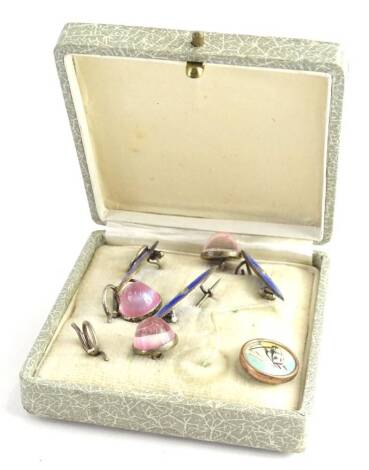 A part gentleman's collar stud set, comprising three pink stone set collar studs, an enamel horse stud, and three blue enamel and seed pearl brooches, all silver plated, boxed.