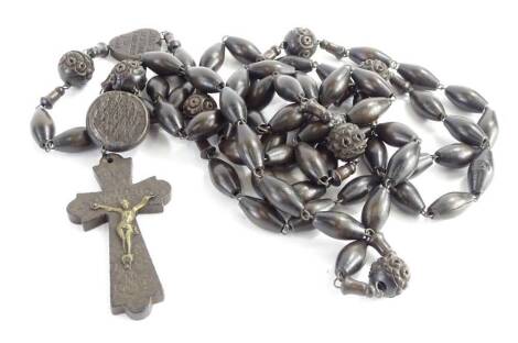 A French ebonised and carved wooden rosary, carved from wood from Lourdes, etc.