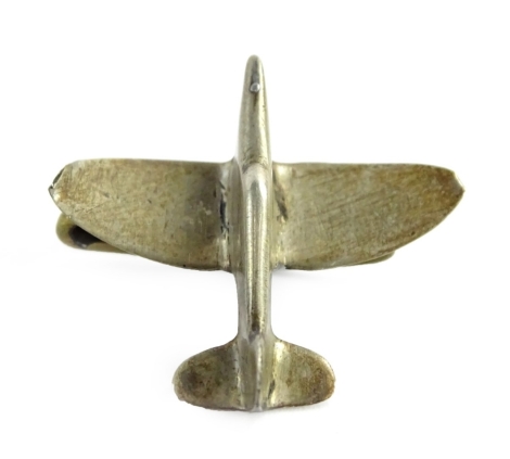 A small silver coloured metal brooch, modelled in the form of a Second Word War aeroplane, probably a spitfire. By Repute Made by prisoners of war during World War 2.