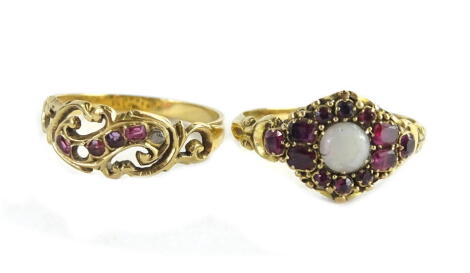 An opal and ruby mounted ring set in 18ct, and a small ruby ring. (2)