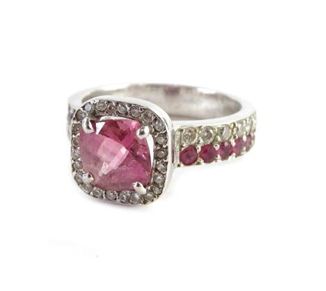 A pink sapphire and diamond dress ring, set in 18ct white gold, stamped 750.