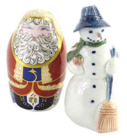 A Royal Copenhagen porcelain model of a snowman, boxed and a Royal Crown Derby porcelain paperweight modelled in the form of Father Christmas, boxed.