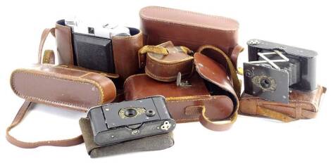 Various bellows cameras, each to include a Zeiss Icon, each with a brown leather or leatherette case.