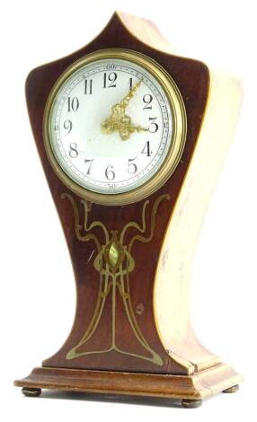 An Edwardian mahogany mantel clock, in Art Nouveau style, case inlaid with pewter and brass with tendrils, etc., the painted dial with Arabic numerals on bun feet, 25cm H.