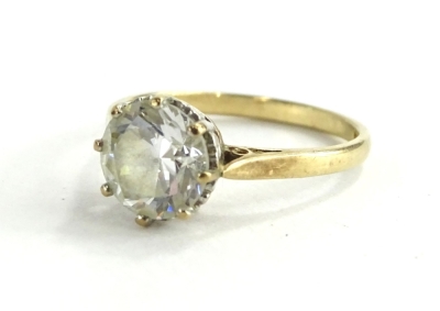 A 9ct gold dress ring, set with single moissanite stone, in eight claw setting, with pierced design shoulders, ring size L½, 2.4g all in.