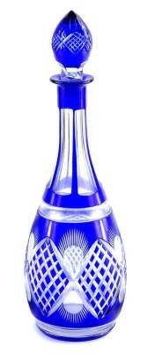 An early 20thC Bohemian blue and clear glass decanter, with shaped stopper and diamond cut body, with a repeat floral pattern, unmarked, 35cm H.