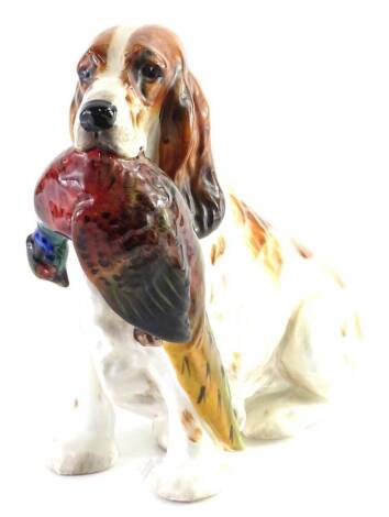 A Royal Doulton figure, of a gun dog with pheasant to mouth, number 1001, printed mark beneath, 16cm H.