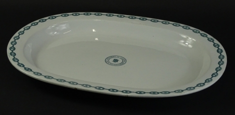 An Ashworth's real ironstone china meat dish, decorated with a stylised metal chain border, and with the crest centrally of the Liverpool Brazil and River plate steamer company, printed manufacturers mark and impressed mark to reverse, 47cm W.