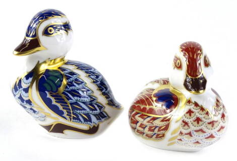 A Royal Crown Derby porcelain duckling, printing mark in red and gold button to underside and another similar. (2)