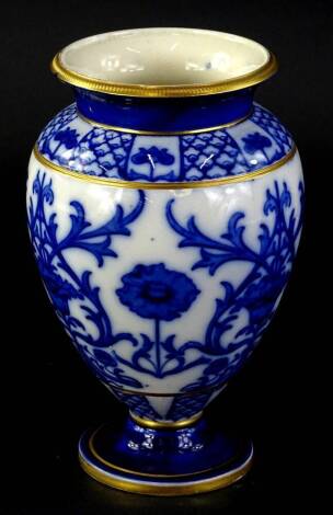 A late 19thC Macintyre Art Nouveau style vase, printed in blue with a design of poppies in the manner of William Moorcroft, within gilt bands, printed marks to underside, 21cm H. (AF)