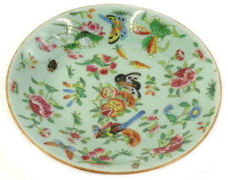 A 19thC Chinese famile rose dessert plate, decorated with birds, fruit, leaves, etc., on a celadon ground, 21.5cm dia.