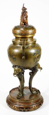 A fine Japanese two-colour patinated bronze koro, with gilt piquet work embellishments, silvered inlays and aplliques of coral and mother-of-pearl, the pierced and domed cover having Kylin surmount, dragon banded insert, the two-handle bulbous body with s - 4