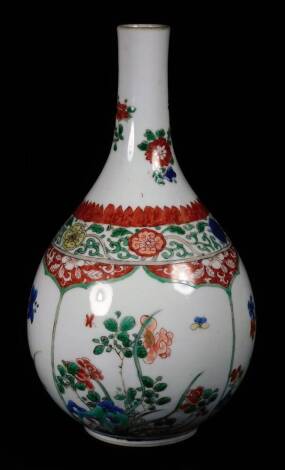 A 19thC Chinese famille vert porcelain bottle vase, decorated with panels of flowers and shrubs below a floral border, 20cm H. (reduced)