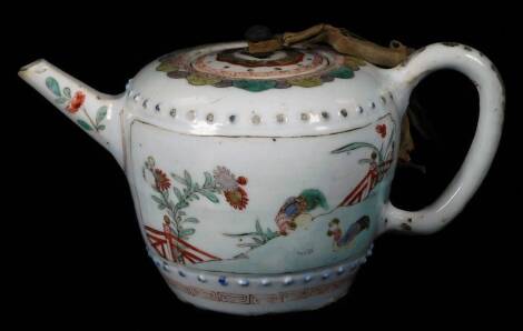 A 19thC Chinese porcelain teapot and cover, decorated with panels of domestic poultry within a landscape setting, unmarked, 11cm H.