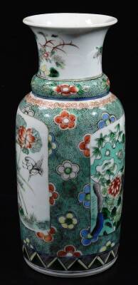 A Chinese porcelain famille vert baluster vase, decorated with panels of hollyhock and watery landscapes, with a stippled ground six character mark, 20cm H. - 2