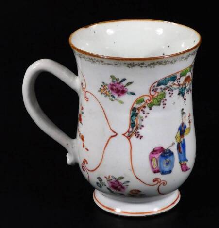 An 18thC Chinese porcelain baluster tankard, decorated with figures within a domestic scene, 12cm H.