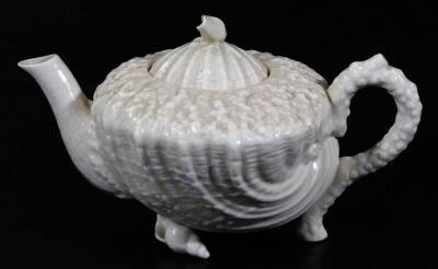 A Belleek 2nd period porcelain part Nautilus pattern tea set, comprising teapot and cover on shell feet, four cups and saucers and creamer, black marked. (a quantity) - 4