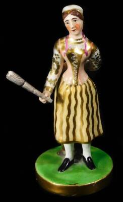 A Chamberlain Worcester figure of Madame Vestry with her broom, the figure standing on a circular base wearing a yellow ground skirt and pink bodice with fine gilding, c1830, 14cm H.