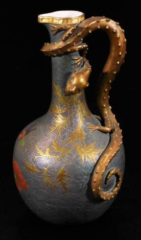 A 19thC Worcester patent porcelain ewer, with entwined handle, cylindrical stem and globular body, decorated with firs and geometric pattern, in a gilt and grey with silvered floral pattern and gilt highlights, marked beneath, 28cm H.