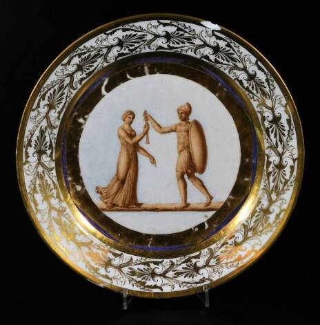 An early 19thC Doccia porcelain plate, classically decorated with figures of a warrior and maiden with a broad gilt reserve and outer border of classical leafage, c1820, 24cm Dia.