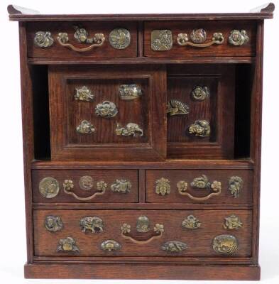 A Japanese shodhana table cabinet, with drawers and sliding panels, decorated with applied embellishments including a toad, crab, fish and figures, 33cm H. - 3