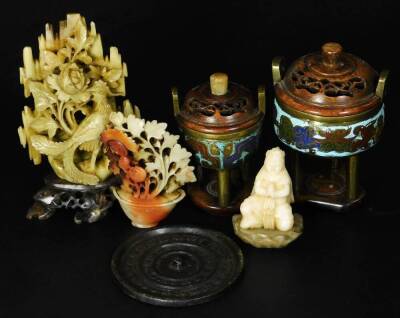 Various soapstone, a carved bird in naturalistic setting, on fixed wooden stand, 15cm H, flower vase, figure and two cast metal graduated incense burners with removable wooden part pierced lids, on cylindrical supports joined by a platform base, 12cm H, e