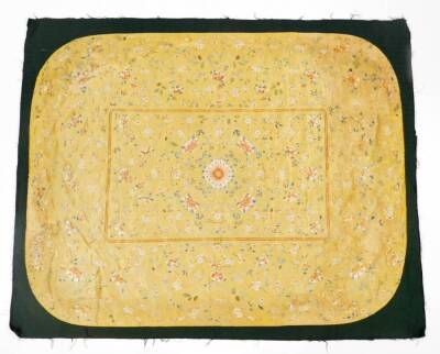 A Imperial Chinese Qing period brocade silk cushion cover, on yellow ground raised with exotic flowers, predominately in orange, blue and green, on material backed ground, 133cm x 103cm. - 2