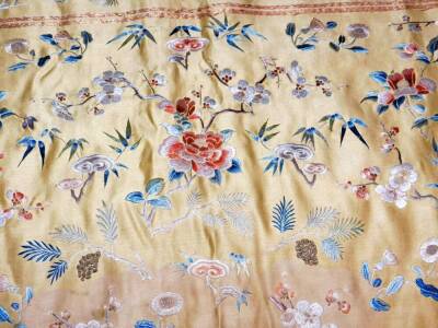 A Imperial Chinese Qing period brocade silk cushion cover, on yellow ground raised with exotic flowers, predominately in orange, blue and green, on material backed ground, 133cm x 103cm. - 7