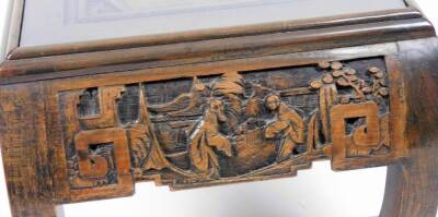 An early 20thC Chinese hardwood low table, heavily carved with figures, interior scenes, etc., on scroll legs, 35cm H, 94cm W, 45cm D. (with original receipt showing purchase in 1958) - 2