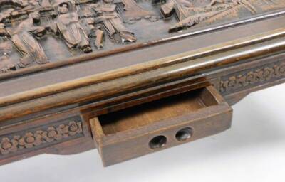 An early 20thC Chinese hardwood low table, heavily carved with figures, interior scenes, etc., on scroll legs, 35cm H, 94cm W, 45cm D. (with original receipt showing purchase in 1958) - 5