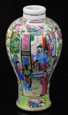 A 19thC Chinese Cantonese baluster vase, of inverted circular shouldered form, famille rose decorated with panels of figures and vases of flowers, etc., predominately in pink, green and yellow, in gilt highlights on a circular foot, 23cm H.