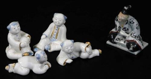 Various Chinese porcelain figures, to include a sage in flowing robes in seated position, 5cm H, various other figures, etc. sparsely decorated. (5)