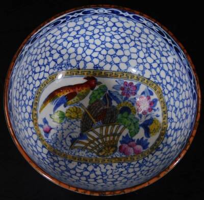 A 19thC Adams commemorative Chinese pottery bowl, polychrome decorated predominately in blue, yellow and green, printed marks beneath, 13cm Dia. a Chinese jar and cover and a signed dish. (3) - 4