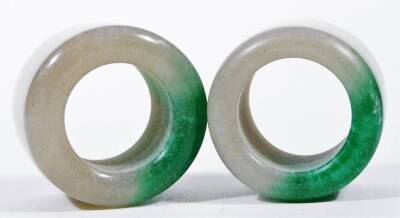 Two jade rings, in green and white colours, each approx 4cm H. (2) - 2