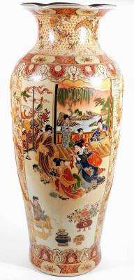 A 20thC Chinese pottery baluster vase, of shouldered form with compressed leaf stem, the body transfer printed and hand touched with panels of figures in an interior setting, with gilt highlights on circular foot, printed red mark beneath, 79cm H.