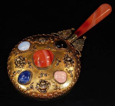 An Eastern style hand mirror, with circular glass and shaped handle, set with polished stones to the back, with an elaborate central section, 22cm H. (boxed) - 2