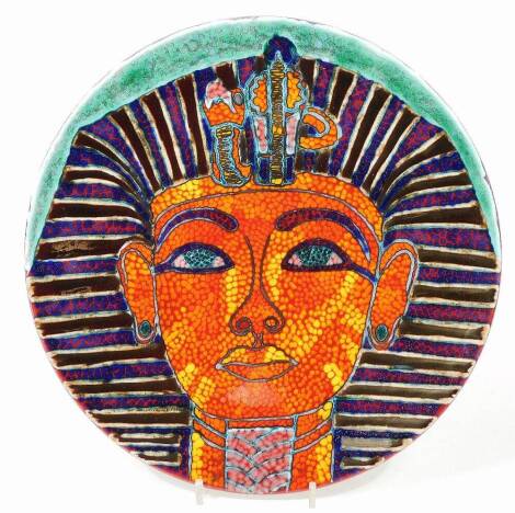 A Poole pottery Tutankhamun charger, decorated in a vivid palette with the image of the Boy King, signed Nicky Masserella, Poole Studio, England, 35cm Dia.