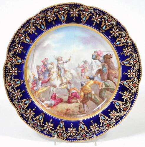 An early 19thC jewelled Sevres porcelain plate, painted with a classical battle scene, double Louis marked 'L' in blue and L, incised script N Conde a la Lataille de Rocryo, c1800, 24cm Dia.