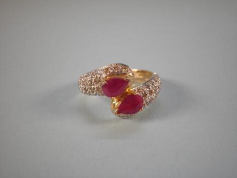 A gold, ruby and diamond ring in the form of serpents